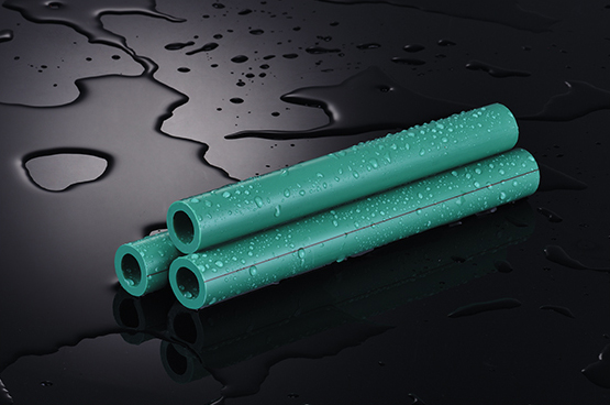 PPR pipes with water drops on black surface